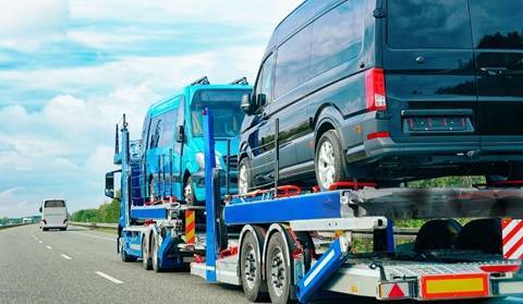 carrier carrying truck and van for relocation