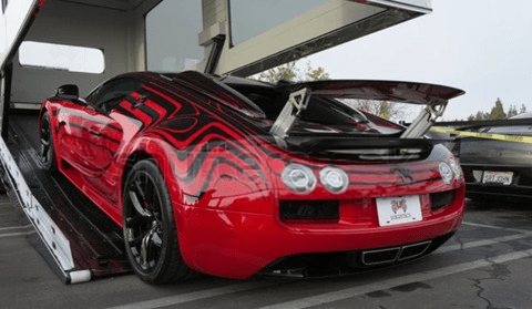 classic-car-being-unloaded-from-an-enclosed-auto-transport-carrier